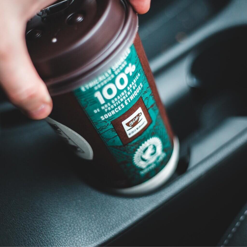 coffee cup with consistent branding design showing logo colours and packaging style
